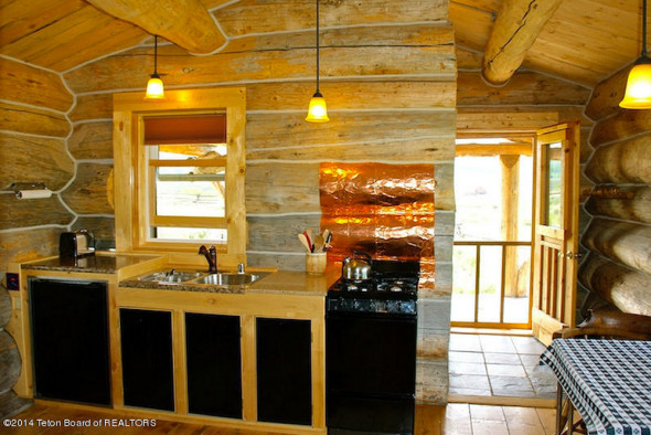 Interior of one bedroom log cabin for sale