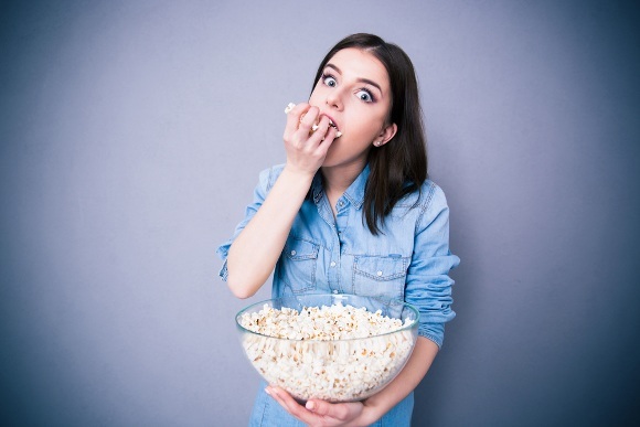 Girl is Eating Popcorn