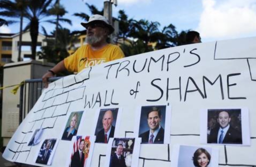 Trump Protesters Unveil WALL OF SHAME Outside His Fundraiser In Doral