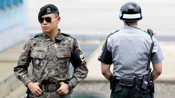 South Korean soldiers stand guard at the village of Panmunjom, on the border shared by South and North Korea, last week. On Monday, Seoul proposed opening new talks to defuse escalating tensions along the border.