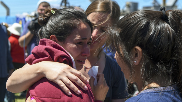 A relative of one of the 44 crew members of the missing Argentine submarine is comforted outside a navy base in Mar del Plata, Argentina, Thursday.