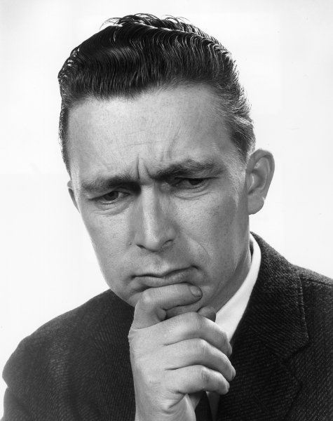 vintage man looking down with pensive look on face 