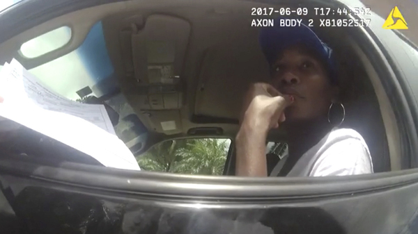 Venus Williams, seen in body camera footage from June, listens to a police officer following a car crash that fatally injured an elderly man.