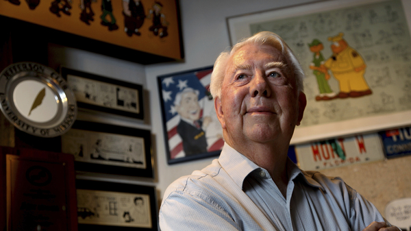 In this August 2010 file photo, Mort Walker, the artist and author of the Beetle Bailey comic strip, stands in his studio in Stamford, Conn.