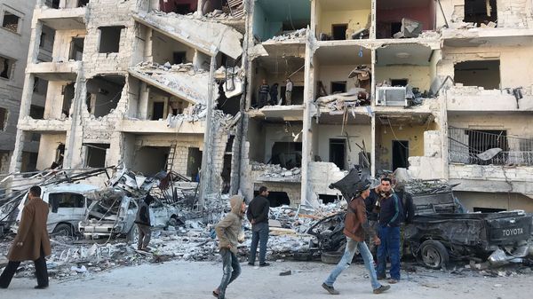 Looking at the damage in the aftermath of an explosion at in a rebel-held area of the northwestern Syrian city of Idlib on Monday.