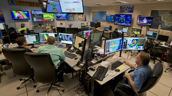 Forecasters at the National Weather Service office monitor Hurricane Irma on Sept. 9, 2017, at the hurricane center in Miami.