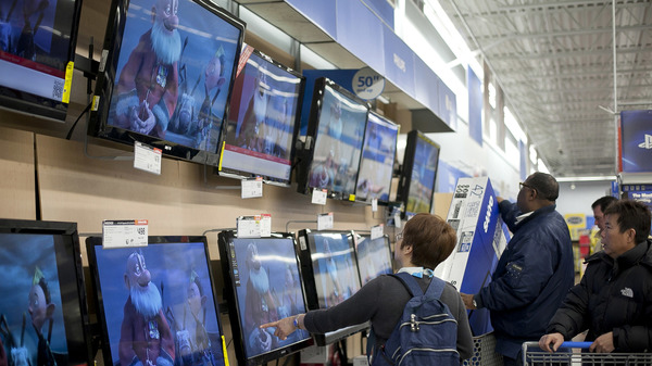 Shoppers look at televisions at a Walmart during Black Friday sales in 2012 in Quincy, Mass.