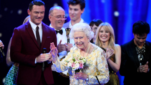 Queen Elizabeth II waves to the audience after a speech from her eldest son Charles, Prince of Wales, at the end of a star-studded concert to celebrate her 92nd birthday at Royal Albert Hall on Saturday.
