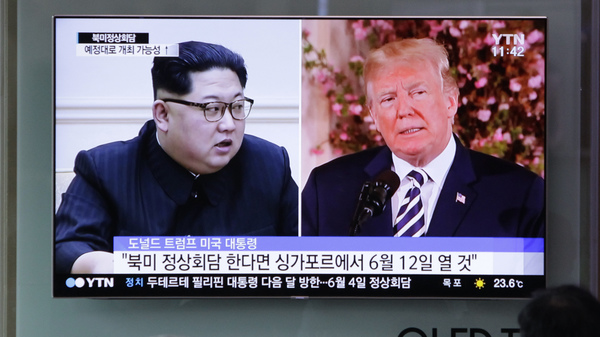A TV screen in the Seoul Railway Station in Seoul, South Korea shows file footage of U.S. President Donald Trump, right, and North Korean leader Kim Jong Un during a news program on Saturday, May 26, 2018.