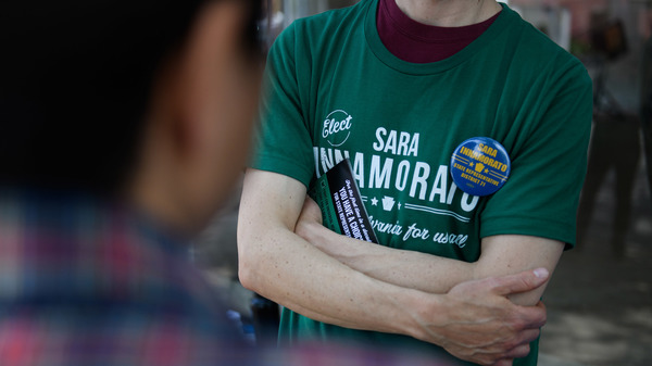 A campaign worker wears a shirt in support of Sara Innamorato outside a polling location at the Oakmont United Methodist Church in Pittsburgh. The first-time candidate declared victory over a five-term incumbent in the Democratic primary for House District 21.